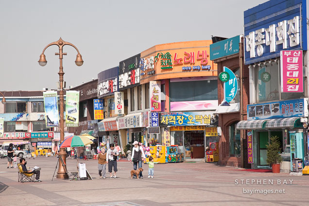 Pedestrians stroll the boardwalk in Wolmido, Incheon, South Korea.