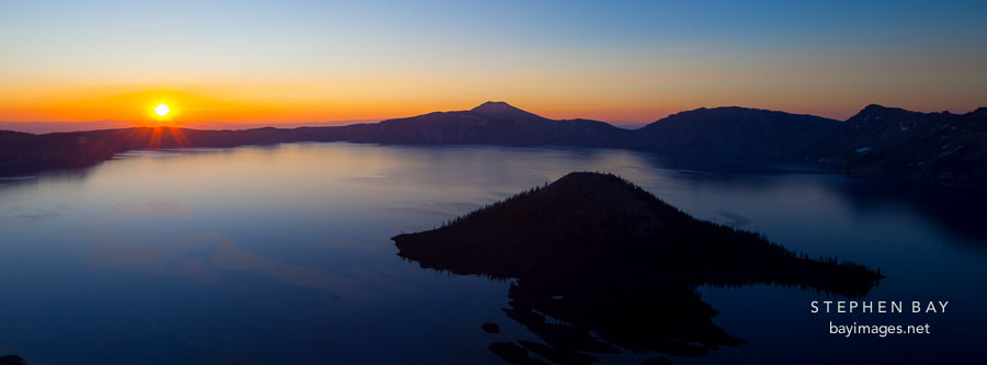 Panorama of sunrise over Crater Lake. Crater Lake National Park, Oregon.