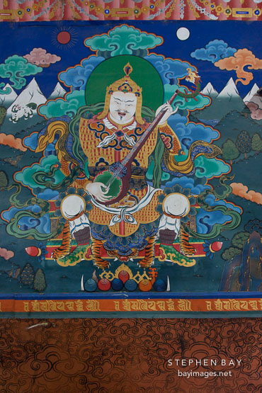 Painting of Yulkhorsung, the white king of the east, playing the lute. Paro Dzong, Bhutan.