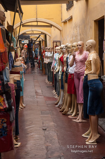 Mannequins lining the entrance of a clothing store. Lima centro, Peru.