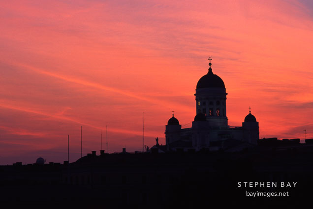 Cathedral with a red sky. St. Nicholas' Church. Helsinki, Finland.