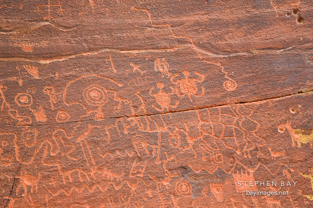 Hundreds of petroglyphs cover the rock wall at V-Bar-V Ranch. Arizona, USA.