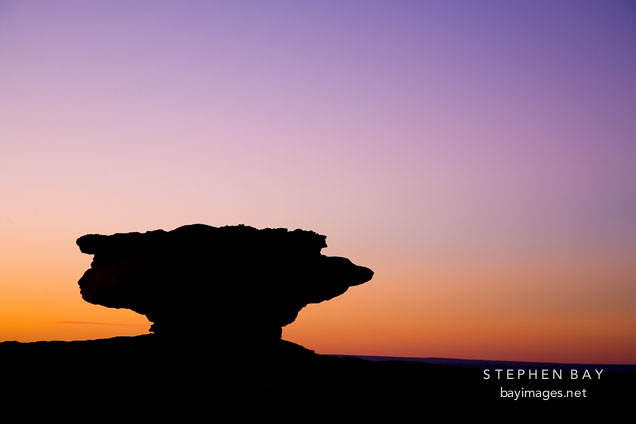 Silhouette of balancing rock at sunset. Canyon de Chelly NM, Arizona.