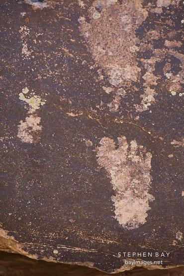 Petroglyph of footprint at Puerco Pueblo, Petrified Forest NP, Arizona.