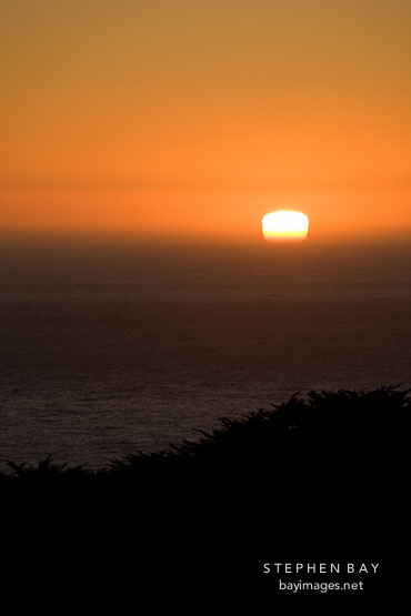 Sunset over the Pacific ocean. Big Sur, California, USA.