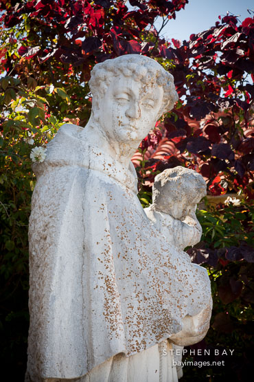 Statue of St Anthony of Padua holding Jesus. Carmel Mission, California.