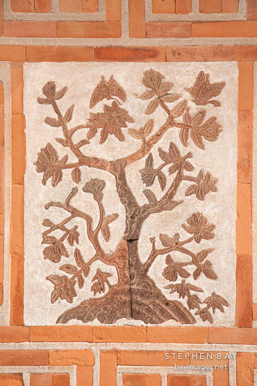 Gyeongbok Palace in Seoul, South Korea features beautiful brick and clay work, such as this image of a tree.