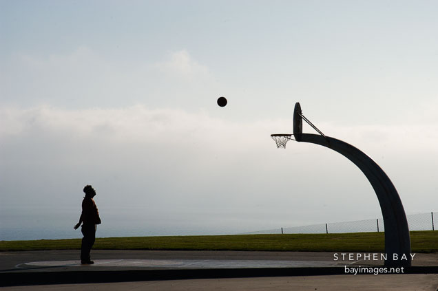 Shooting hoops at Angels Gate Park. San Pedro, California, USA.