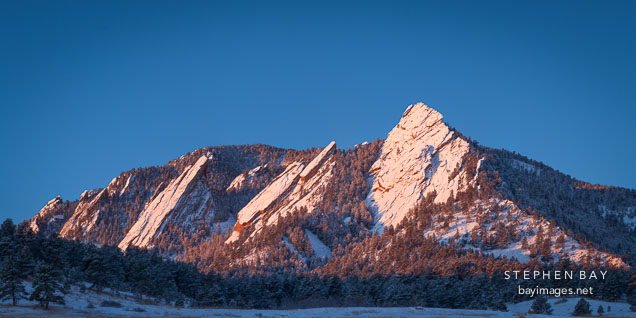 Winter sunrise on the Flatirons. Boulder, Colorado.