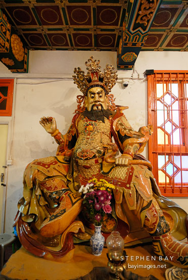 West deva-king holding a pearl and dragon. Welto Temple, Po Lin Monastery, Hong Kong, China.