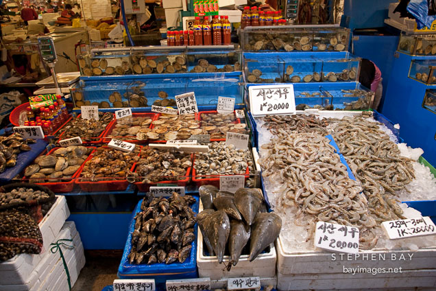 An overflowing stall awaits shoppers at the Noryangjin Fish Market in Seoul.