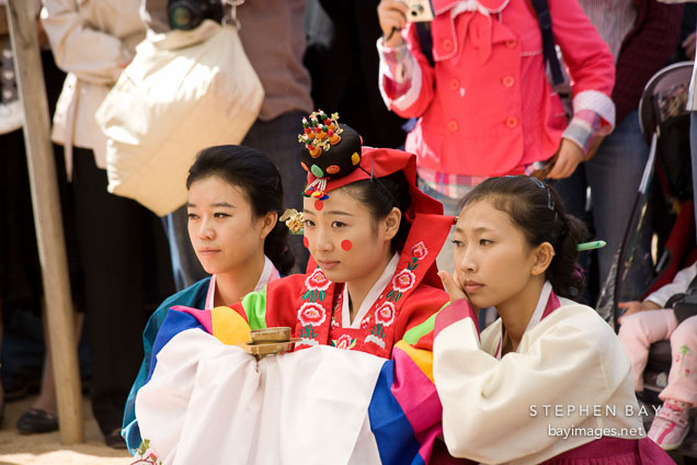 Bride and bridesmaids at a traditional Korean wedding. Korean Folk Village, Yongin.