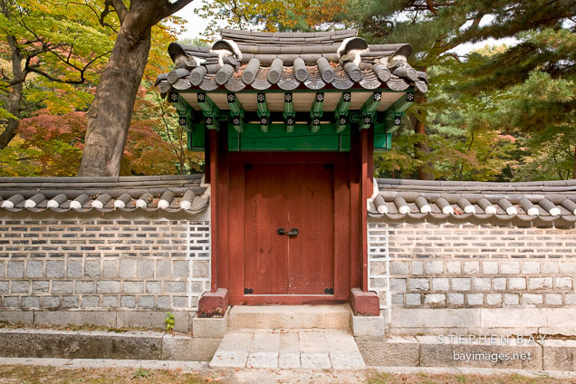 Door and gateway leading into one of the many courtyards at Changdeok Palace in Seoul, South Korea.