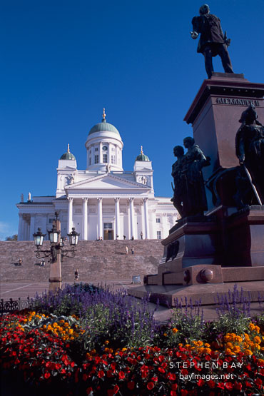 Flowers, statue of Tsar Alexander, and the Cathedral. Helsinki, Finland.