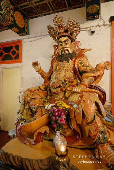 West deva-king holding a pearl and dragon. Welto Temple, Po Lin Monastery, Hong Kong, China.