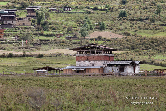 Farmhouse on the edge of the valley floor. Phobjikha Valley, Bhutan.