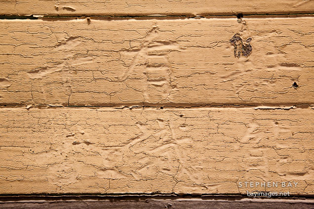 Chinese characters carved into wood and painted over. Angel Island Immigration Station.
