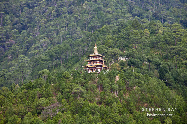 Khamsum Yuelley Namgyal Chorten sits high up on a forrested hillside. Punakha valley, Bhutan.