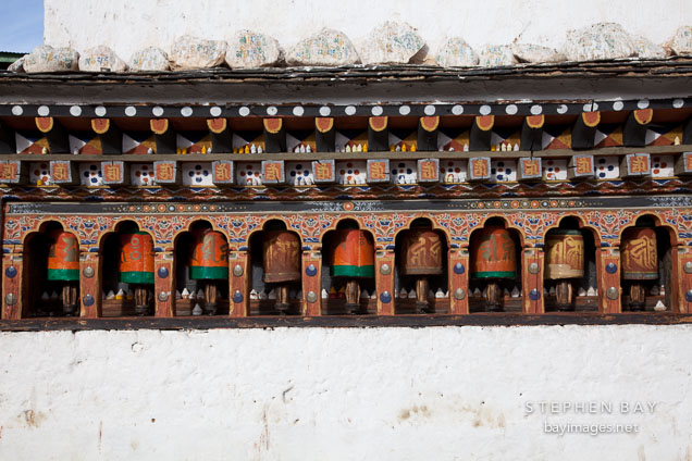 Prayer wheels on the Chorten Lhakhang. Paro, Bhutan.