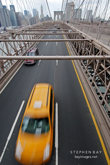 Brooklyn Bridge and taxi cab. New York City, New York, USA.
