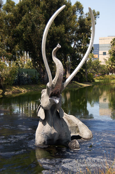 Struggling mastodon trapped in the La Brea tar pits. Los Angeles, California, USA.