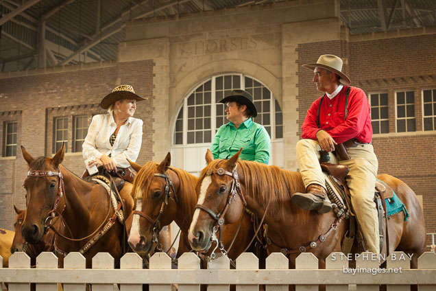 Competitors talking during break at the cowby mounted shooting competition. Iowa State Fair, Des Moines.