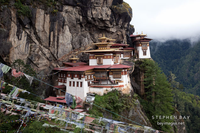Taktshang Goemba (Tiger's Nest) monastery and prayer flags. Paro Valley, Bhutan.
