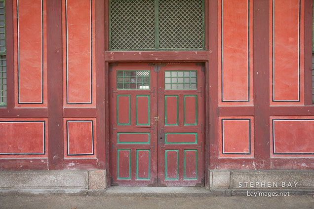 A large set of doors on the grounds of Deoksu Palace in Seoul, South Korea.