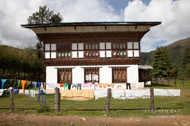 House with laundry drying outside. Phobjikha Valley, Bhutan.
