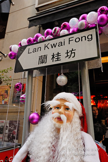 Lan Kwai Fong street sign and Santa Claus. Hong Kong, China.