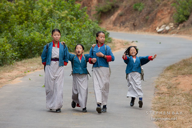 Young children walk to school in the early morning. Punakha, Bhutan.