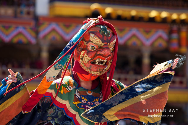 Dancer with frightening mask and brocade dress. Thimphu tsechu, Bhutan.