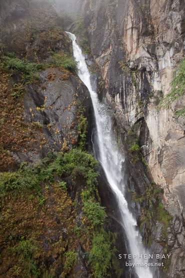 Waterfall (Shelkar Zar) near Taktshang monastery. Paro Valley, Bhutan.