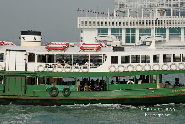 Star Ferry pulling into Kowloon Pier. Hong Kong, China