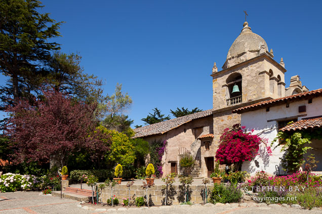 Courtyard and bell tower at Carmel Mission. Carmel, California.