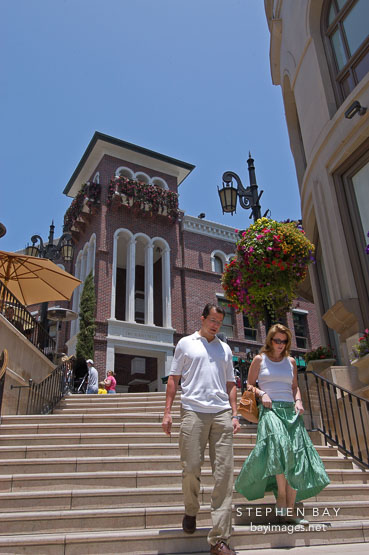 Couple walking down spanish steps at Two Rodeo drive. Beverly Hills, California, USA