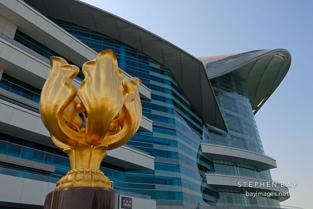Golden Bauhinia statue in front of the Hong Kong Convention center. Hong Kong, China.