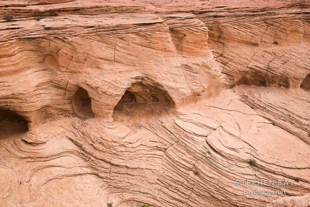 Caves created in the sandstone rock by wind erosion. Canyon de Chelly NM, Arizona.