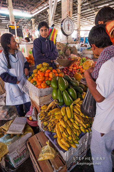 Selling plantains and other fruit in the central market. Cusco, Peru.
