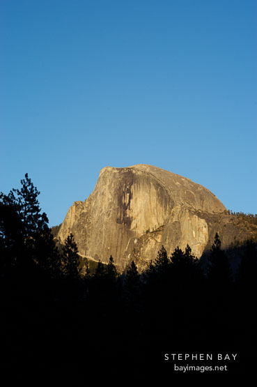 The sun sets on Half Dome. Yosemite National Park, California, USA.
