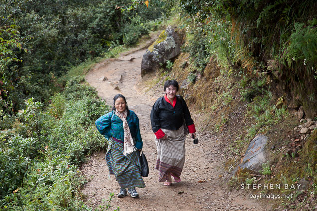 Women traveling to Taktshang Goemba. Paro Valley, Bhutan.