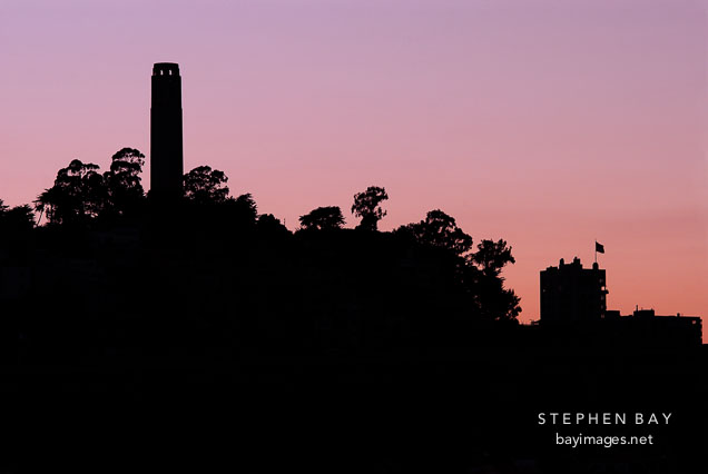 Silhouette of Coit Tower at sunset, San Francisco, California.