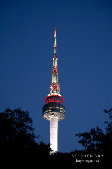 At twilight, N Seoul Tower rises above Namsan Mountain in Seoul, South Korea.