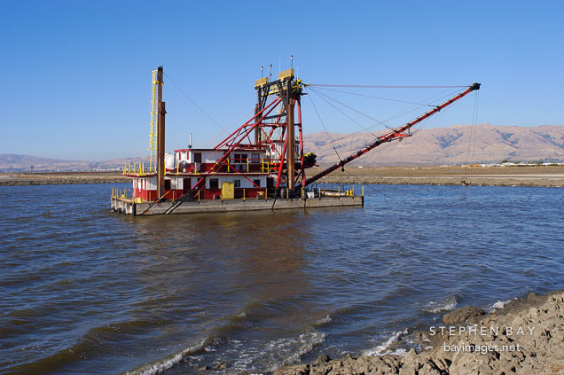 Clamshell Dredge Maintaining Alviso Slough. San Jose, California, California.