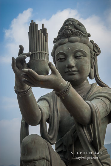 Buddhist statues praising the Tian Tan Budha. Lantau Island, Hong Kong, China.