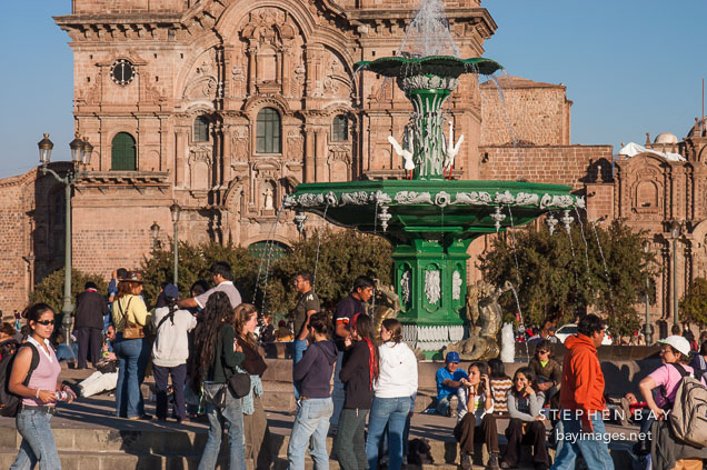 Fountain in Plaza de Armas and Iglesia de la Compania de Jesus. Cusco, Peru.