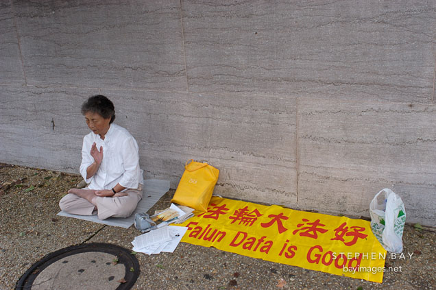Woman meditating and practicing Falun Dafa. Washington. D.C.
