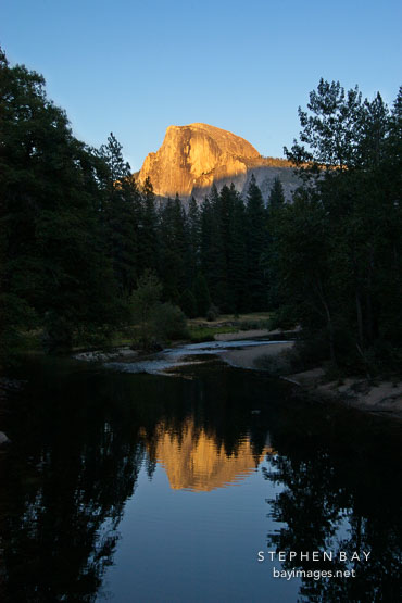 Half Dome and reflection in the Merced river. Yosemite National Park, California, USA.
