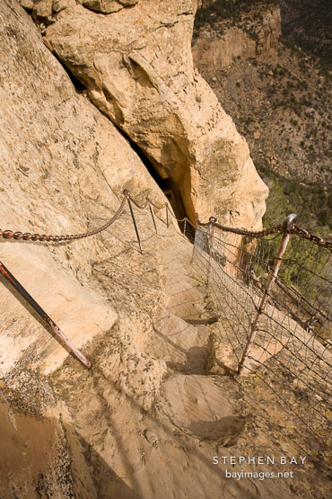 Narrow steps carved into the rock at the Southern entrance to Balcony House. Mesa Verde NP, Colorado.