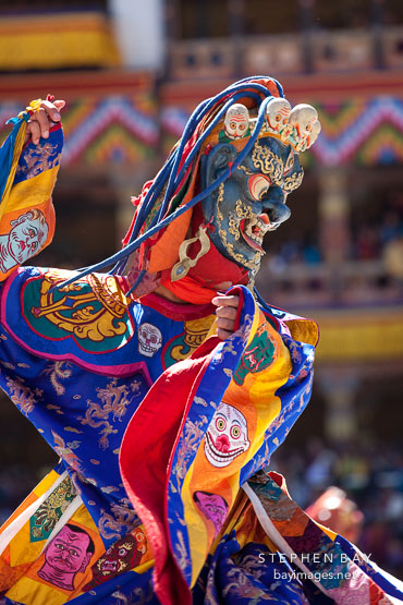 Dancer with frightening mask and brocade dress. Thimphu tsechu, Bhutan.
